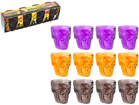 Quattro bicchierini a forma di teschio in plastica viola, arancione e grigia