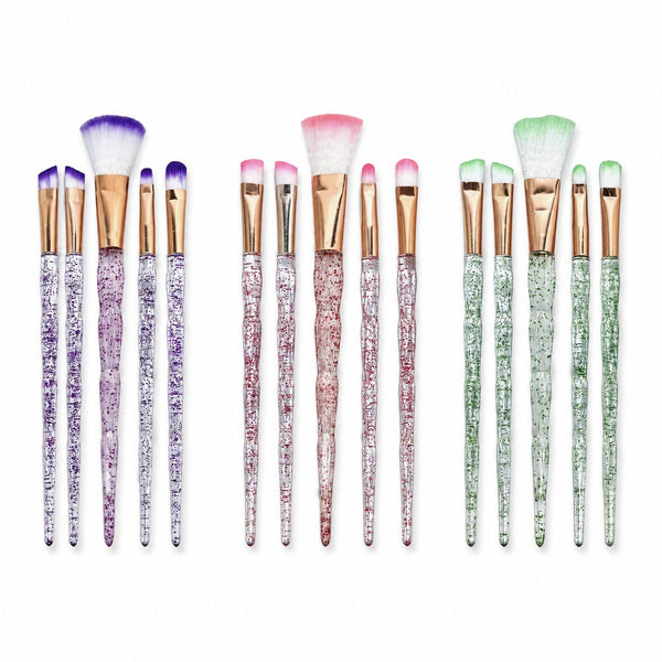 Set di cinque pennelli da trucco con manico trasparente glitterato e ghiera dorata, in tre colori
