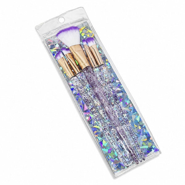 Set di cinque pennelli da trucco con manico trasparente glitterato e ghiera dorata, in tre colori