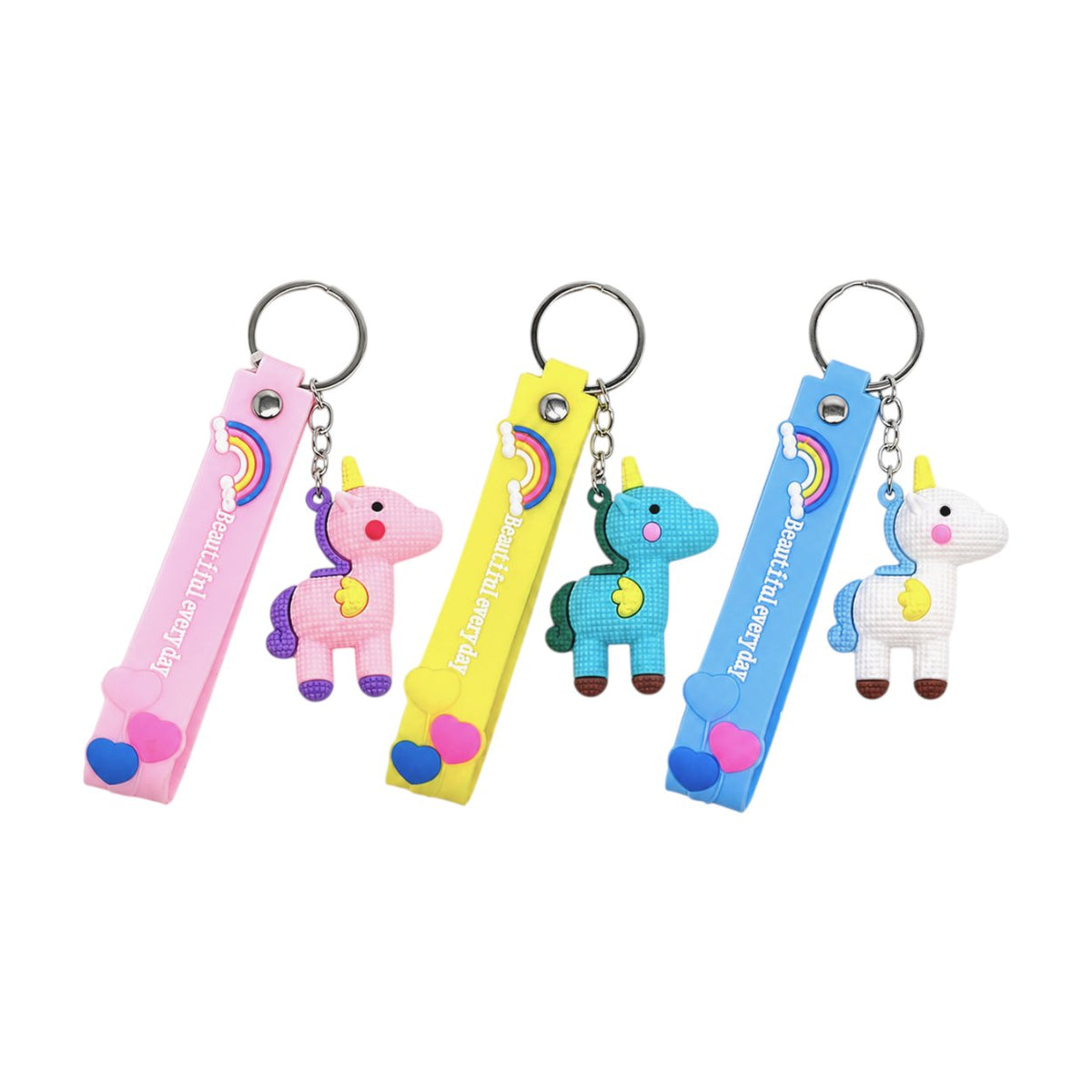 Tre portachiavi con unicorno kawaii in rosa, giallo e blu con strap decorato e arcobaleno