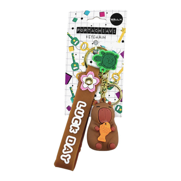 Tre portachiavi a forma di capibara marrone con fiori rosa, accessori verdi e anellino dorato, stile kawaii