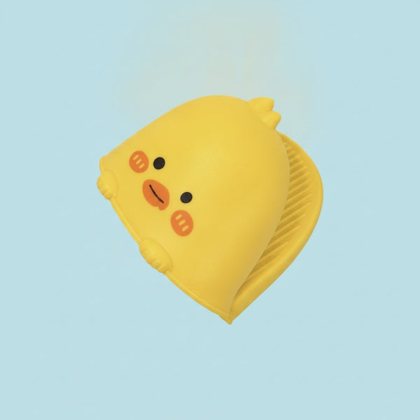 Presina in silicone giallo a forma di pulcino con faccina tenera e dettagli arancioni