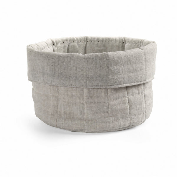 Cestino rotondo in tessuto beige con bordo arrotolato, disponibile in quattro varianti di colore