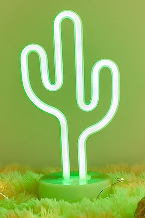 Lampada neon cactus verde e bianca su base verde con erba sintetica, design moderno e luminoso