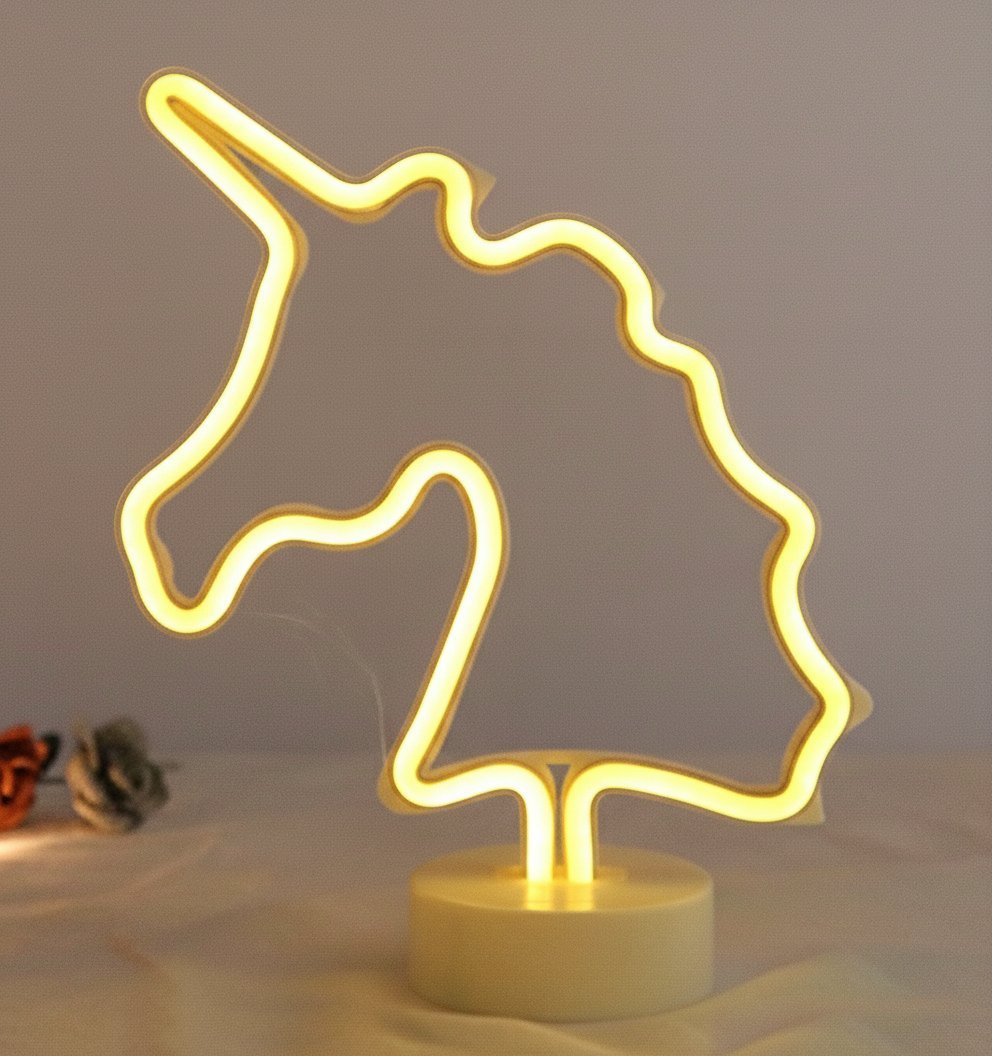 Lampada neon unicorno con tubo luminoso giallo oro, design stilizzato su base bianca, decorazione moderna
