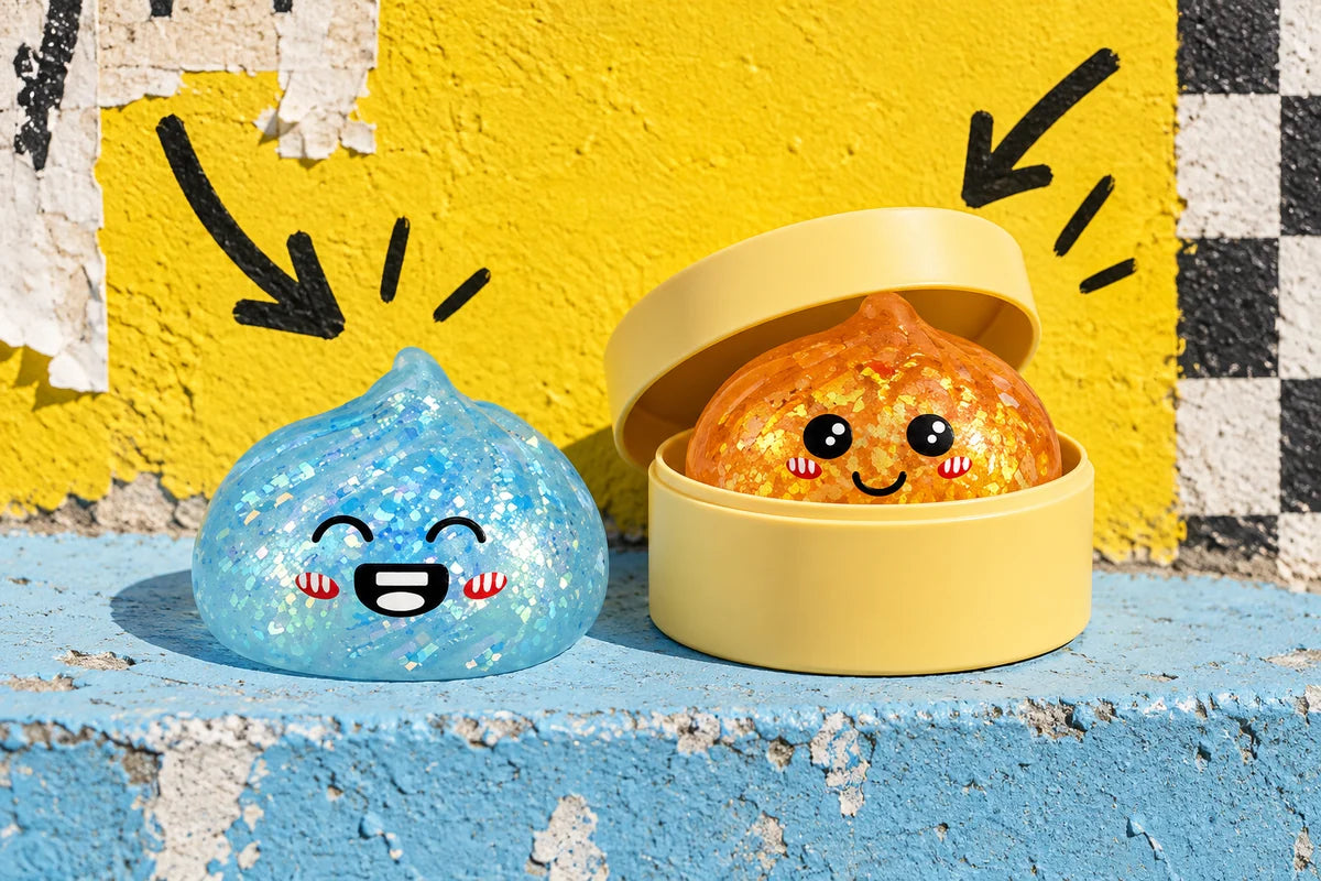 Squishy dumpling azzurro e arancione con scatolina gialla a vaporiera